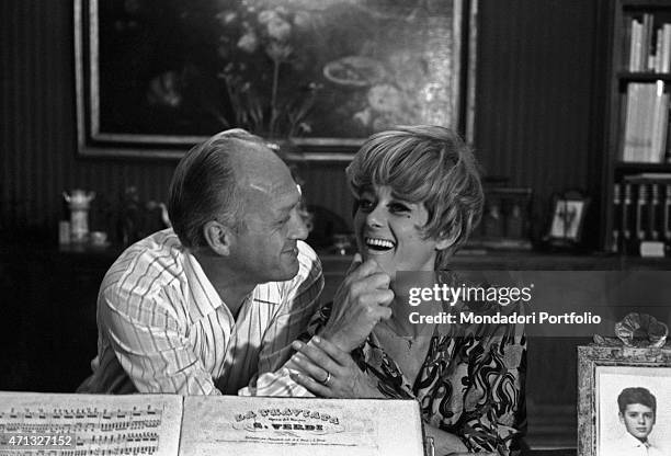 Italian TV artists Raimondo Vianello and Sandra Mondaini joking together. 1967