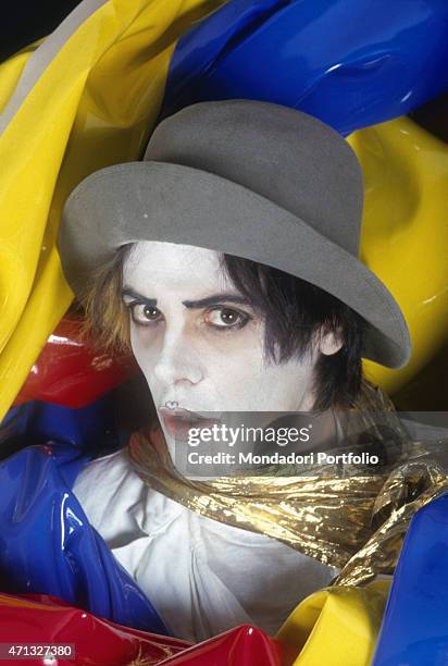 Italian singer-songwriter, guitarist and theatre artist Alberto Camerini posing dressed as Arlecchino. Italy, 1981