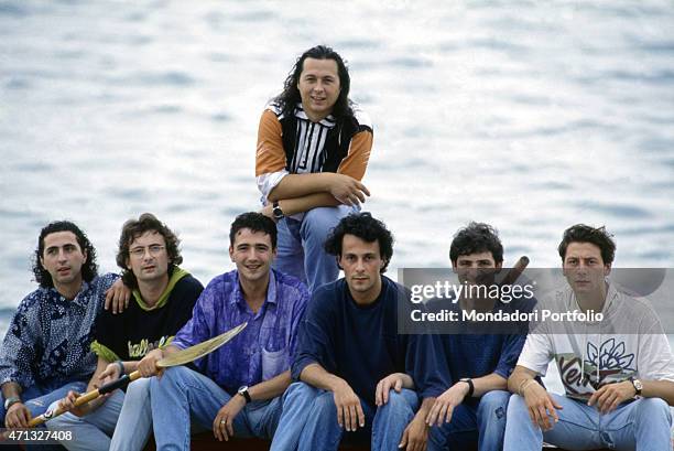 Italian band Ladri di biciclette posing on the beach. Italian singer Paolo Belli is the leader of the band. Italy, 1991