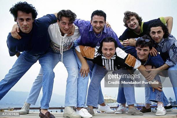 Italian band Ladri di biciclette posing on a pier. Italian singer Paolo Belli is the leader of the band. Italy, 1991
