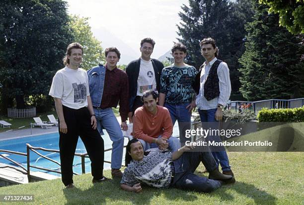 Italian band Ladri di biciclette posing with Italian singer-songwriter Francesco Baccini with whom they wrote and recorded the song Sotto questo...