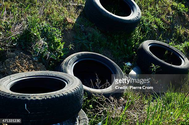 Used tyres are discarded as people participate in street racing on the outskirts of Odessa on April 26, 2015 in Odessa, Ukraine. Although life in the...