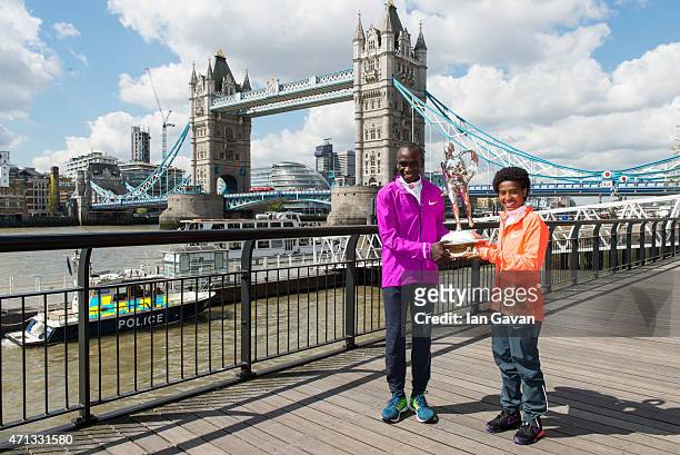 Kenya men's winner Eliud Kipchoge and Ethiopian women's winner Tigist Tufa pose during a photocall after winning the London Marathon at the Tower...