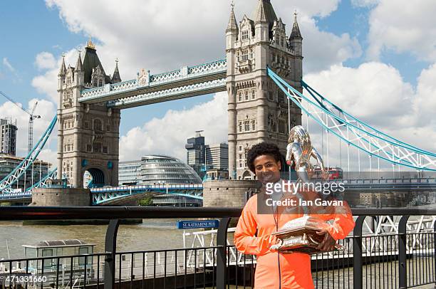 Ethiopian women's winner Tigist Tufa poses during a photocall after winning the London Marathon at the Tower Hotel on April 27, 2015 in London,...