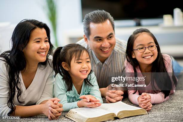 Family Studying Bible Photos and Premium High Res Pictures - Getty Images