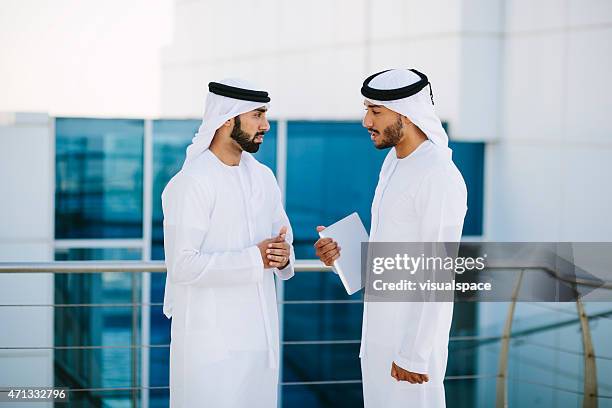 two arab businessmen - businessman hotel stock pictures, royalty-free photos & images