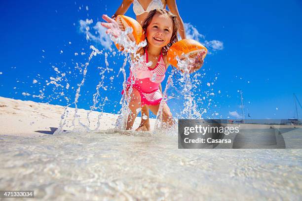 little girl playing on idylic beach - mauritius beach bildbanksfoton och bilder