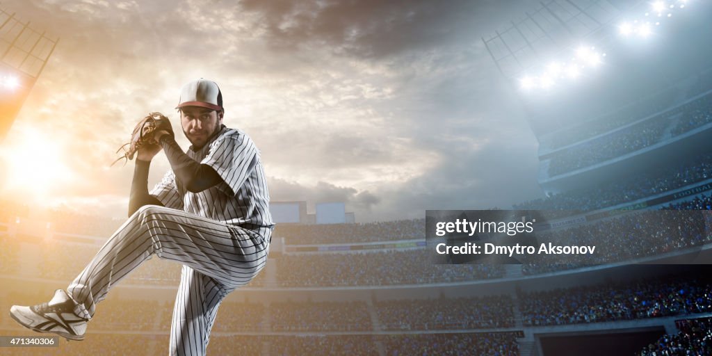 Baseball player pitching a ball in a stadium