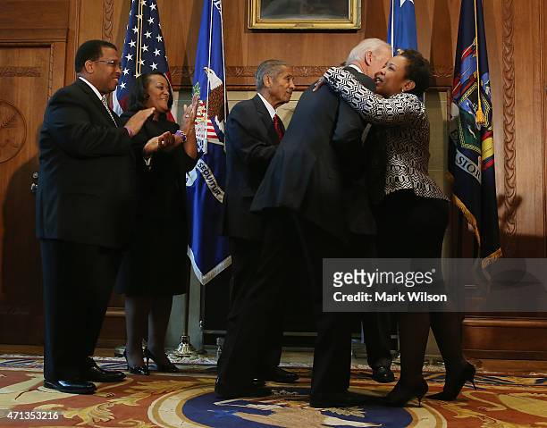 Loretta Lynch hugs US Vice President Joe Biden after being sworn in as Attorney General at the Justice Department April 27, 2015 in Washington, DC....