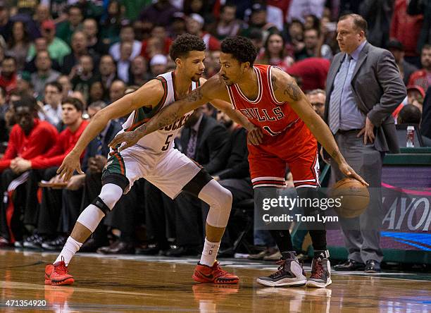 Guard Derrick Rose of the Chicago Bulls sets up a play as Michael Carter-Williams of the Milwaukee Bucks defends in the first quarter of game three...