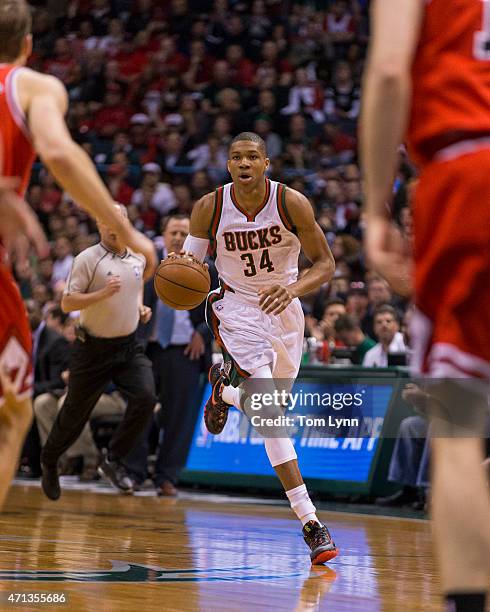 Forward Giannis Antetokounmpo of the Milwaukee Bucks brings the ball up court against the Chicago Bulls in the first quarter of game four of the...
