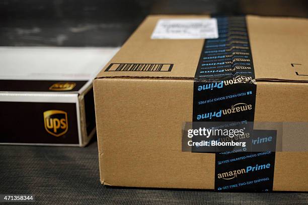 Package shipped from Amazon.com moves down a conveyor belt during the afternoon sort at the United Parcel Service Inc. Worldport facility in...