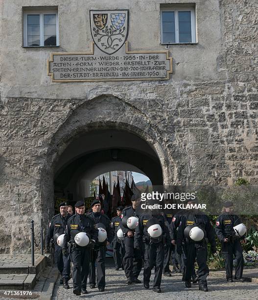 Austrian police officers walk towards the house where Adolf Hitler was born during the anti-Nazi protest in Braunau Am Inn, Austria on April 18,...