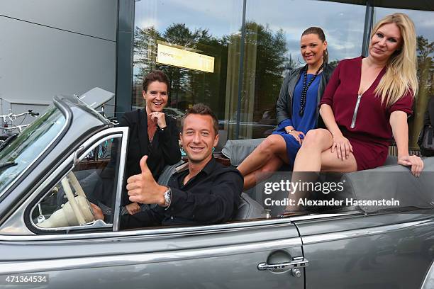 Philipp Kohlschreiber arrives with Katarina Witt , Simone Ballack and Magdalena Brzeska in a historical BMW car for the Iphitos Tennis Club 100 years...