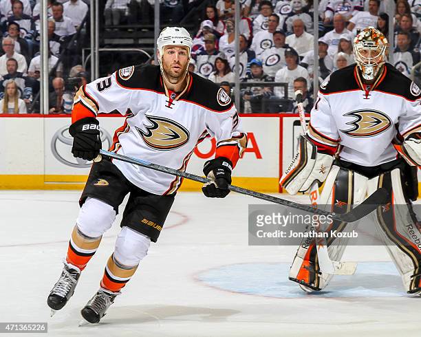 Clayton Stoner of the Anaheim Ducks keeps an eye on the play along the boards during third period action against the Winnipeg Jets in Game Four of...