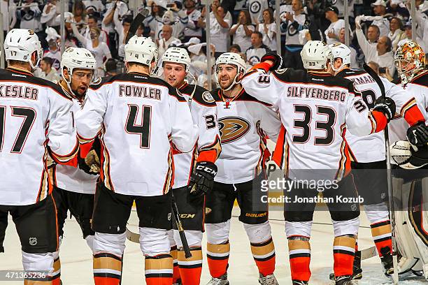 Anaheim Ducks players celebrate after defeating the Winnipeg Jets 5-2 in Game Four of the Western Conference Quarterfinals during the 2015 NHL...