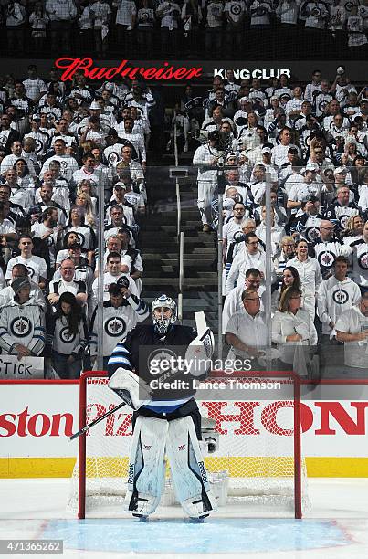 Goaltender Ondrej Pavelec of the Winnipeg Jets gets set in the crease prior to puck drop against the Anaheim Ducks in Game Four of the Western...