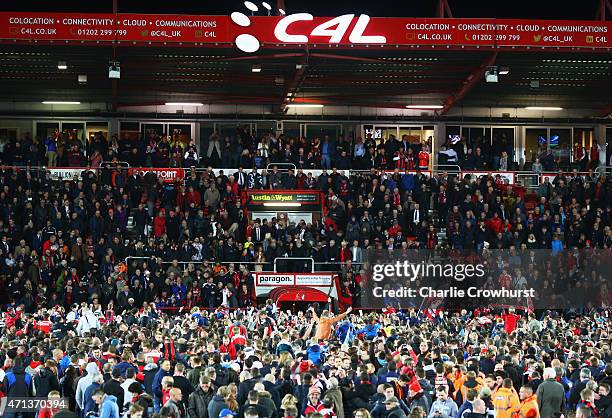 Fans invade the pitch to celebrate victory after the Sky Bet Championship match between AFC Bournemouth and Bolton Wanderers at Goldsands Stadium on...