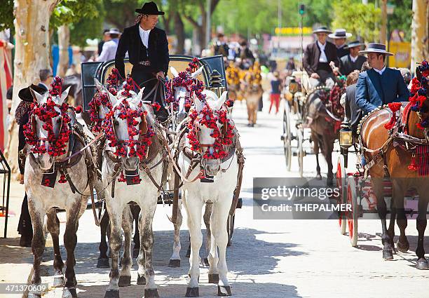 cavalo desenhado cadeiras no fair de sevilha - parque de diversão imagens e fotografias de stock