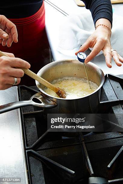 Actress Debi Mazar and chef Gabriele Corcos are photographed making burrata for Cheese Connoisseur on October 27, 2014 in New York City.