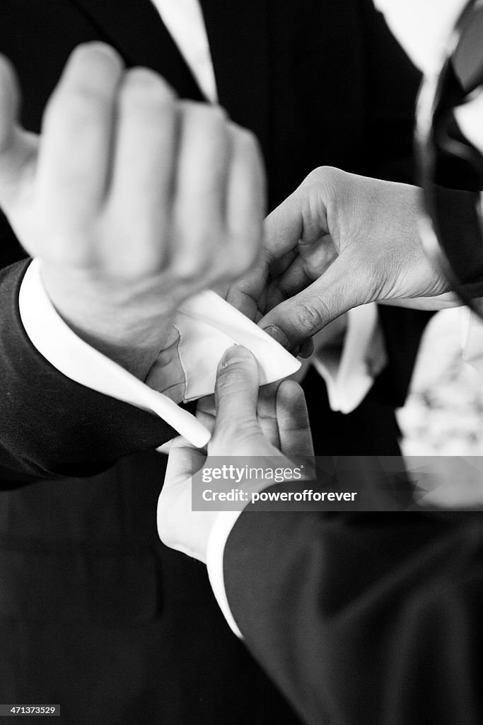 Best Man Helping Groom with Cuff links