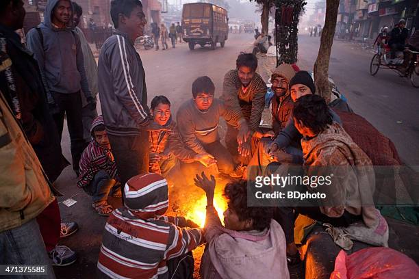 homeless men in new delhi, india - winter stock pictures, royalty-free photos & images