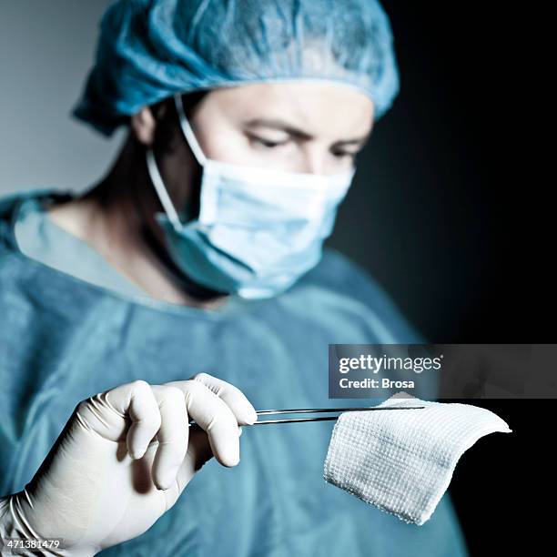 surgeon at work - gauze stock pictures, royalty-free photos & images