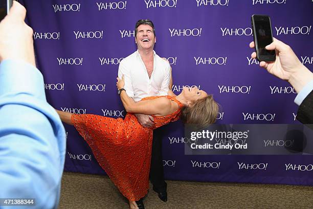 Producer Simon Cowell and journalist Katie Couric attend the 2015 Yahoo Digital Content NewFronts at Avery Fisher Hall on April 27, 2015 in New York...