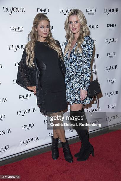 Nicky Hilton and Paris Hilton attend DuJour Magazine's April Cover Celebration with Paris Hilton at PHD at the Dream Downtown on April 27, 2015 in...