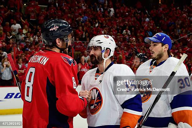 Alex Ovechkin of the Washington Capitals and Cal Clutterbuck of the New York Islanders shake hands following the Capitals victory over the Islanders...