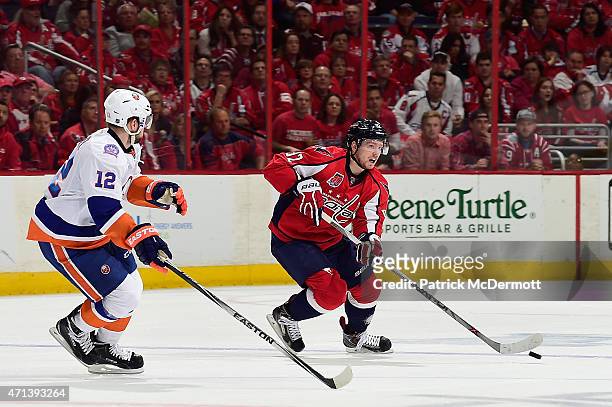 Evgeny Kuznetsov of the Washington Capitals controls the puck against Josh Bailey of the New York Islanders during the second period in Game Seven of...