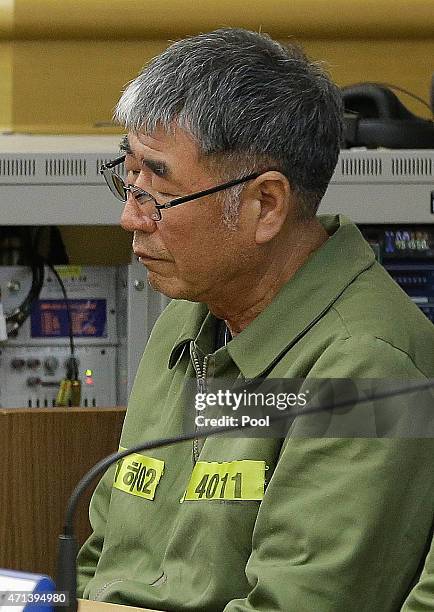 Lee Joon-Seok, the captain of the sunken South Korean ferry Sewol, sits for verdicts as the ship's crew members are charged with negligence and...