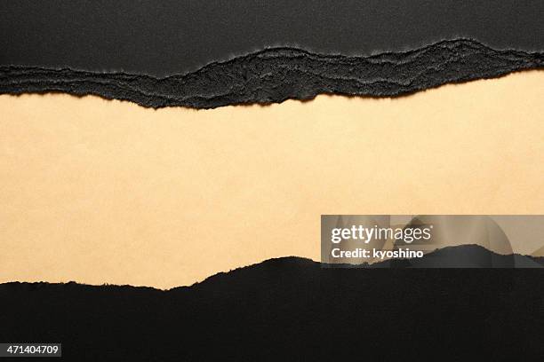 black torn paper borders on brown wrapping paper - black craft paper stock pictures, royalty-free photos & images