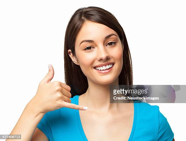 smiling woman in blue shirt with call me hand gesture - call me hand sign stock pictures, royalty-free photos & images