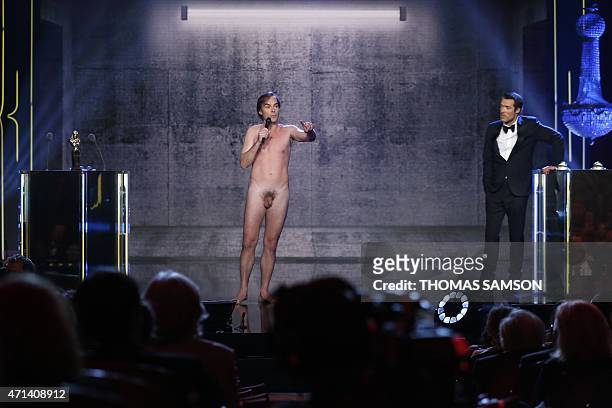 French actor and writer Sebastien Thiery performs naked next to Master of ceremonies, French actor and director Nicolas Bedos during the 27th...