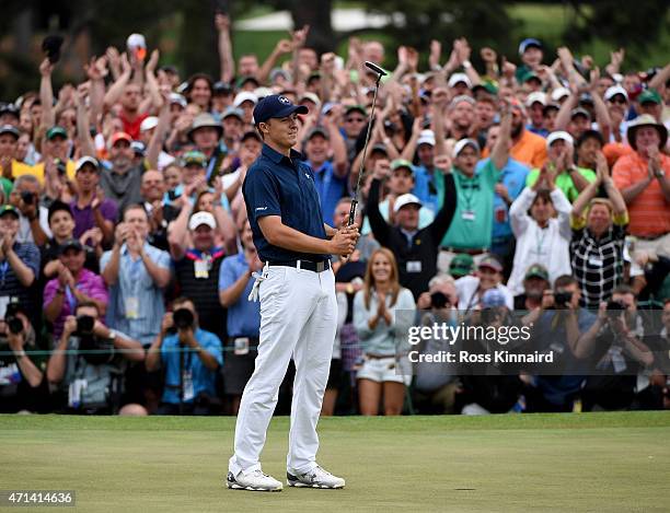 Jordan Spieth of the United States celebrates on the 18th green after winning the 2015 Masters at Augusta National Golf Club on April 12, 2015 in...