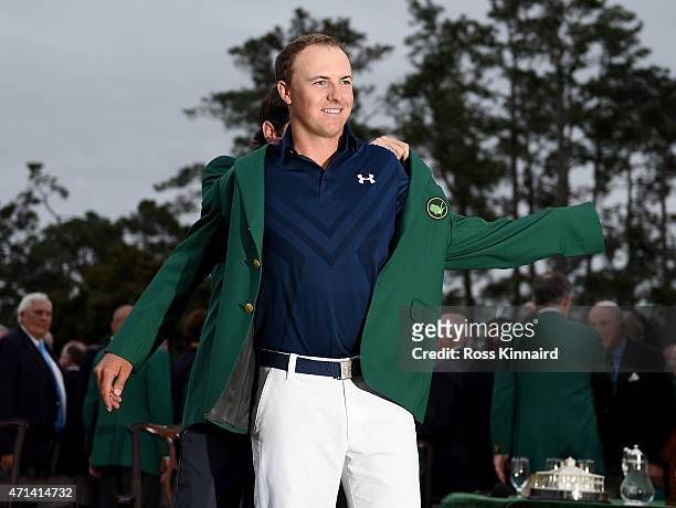 Jordan Spieth of the United States is presented with his Green Jacket after the final round of the 2015 Masters at Augusta National Golf Club on...