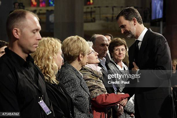King Felipe VI of Spain gives his condolences to victim's relatives as he attends the state funeral service for the victims of the Germanwings plane...