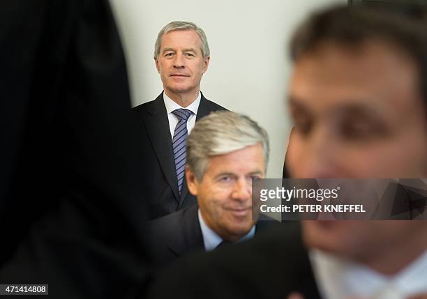 Deutsche Bank ex-chief executive Josef Ackermann and Deutsche Bank co-CEO Juergen Fitschen wait for the start of their trial at court in Munich,...