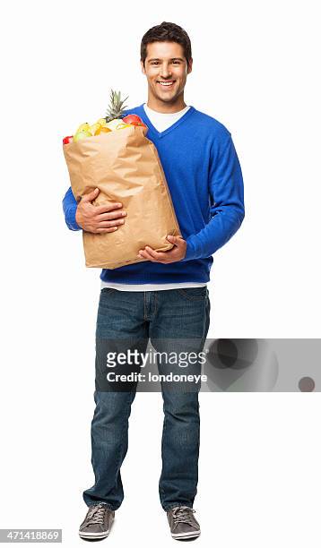 young man carrying large bag of groceries - isolated - fruit stand stock pictures, royalty-free photos & images