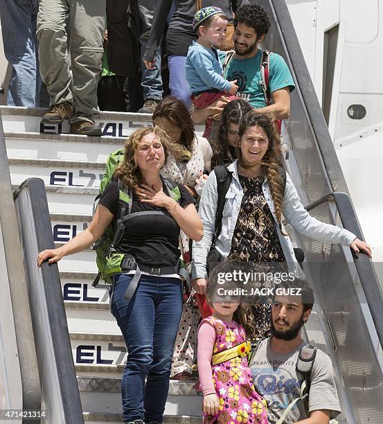 Israeli tourists disembark their plane at Ben Gurion airport near Tel Aviv on April 28 following their repatriation from quake-hit Nepal. Israel...