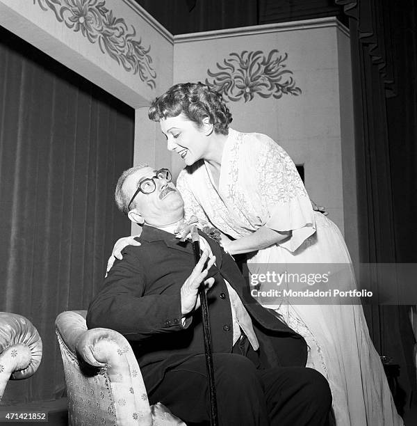 "Giuseppe De Filippo, known as Peppino, the Italian comic actor and playwright, on stage with Lidia Martora, during an act of the comedy Il...