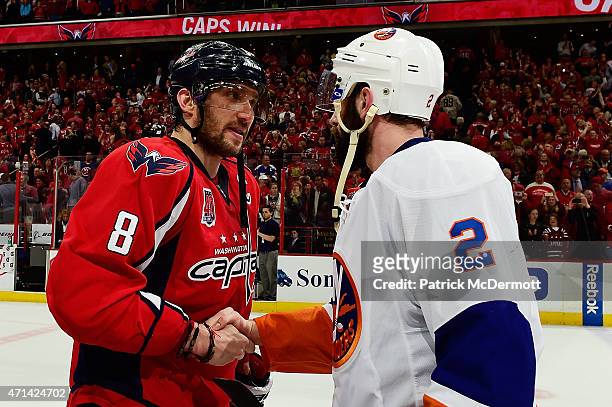 Alex Ovechkin of the Washington Capitals and Nick Leddy of the New York Islanders shake hands following the Capitals victory over the Islanders in...