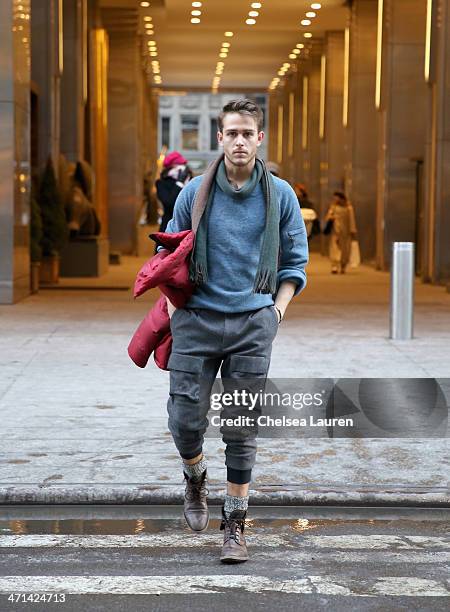 Adam Gallagher, menswear blogger of iamgalla.com seen wearing a red jacket, blue sweater, and pants by Black Sail by Nautica Fall 2014, with his own...