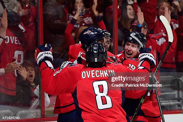 Joel Ward of the Washington Capitals celebrates with his teammates after scoring a goal in the second period against the New York Islanders in Game...