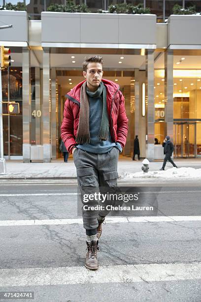 Adam Gallagher, menswear blogger of iamgalla.com seen wearing a red jacket, blue sweater, and pants by Black Sail by Nautica Fall 2014, with his own...