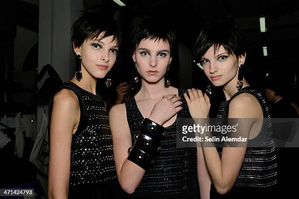 Models pose backstage ahead of Emporio Armani show during Milan Fashion Week Womenswear Autumn/Winter 2014 on February 21, 2014 in Milan, Italy.