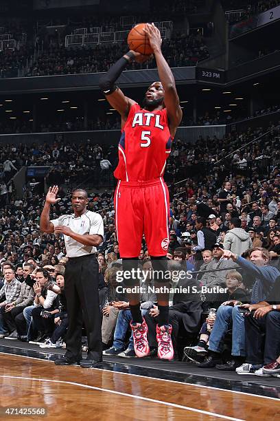 DeMarre Carroll of the Atlanta Hawks shoots the ball in Game Three of the Eastern Conference Quarterfinals against the Brooklyn Nets during the 2015...