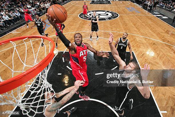 DeMarre Carroll of the Atlanta Hawks drives to the basket in Game Three of the Eastern Conference Quarterfinals against the Brooklyn Nets during the...