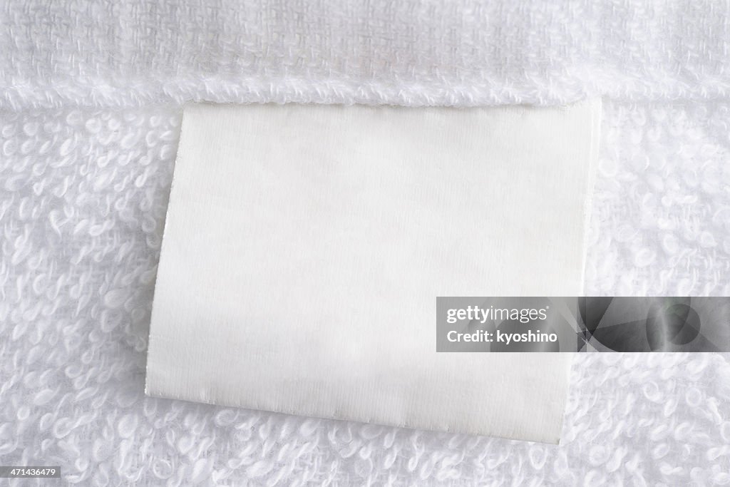 Close up of white towel with blank label